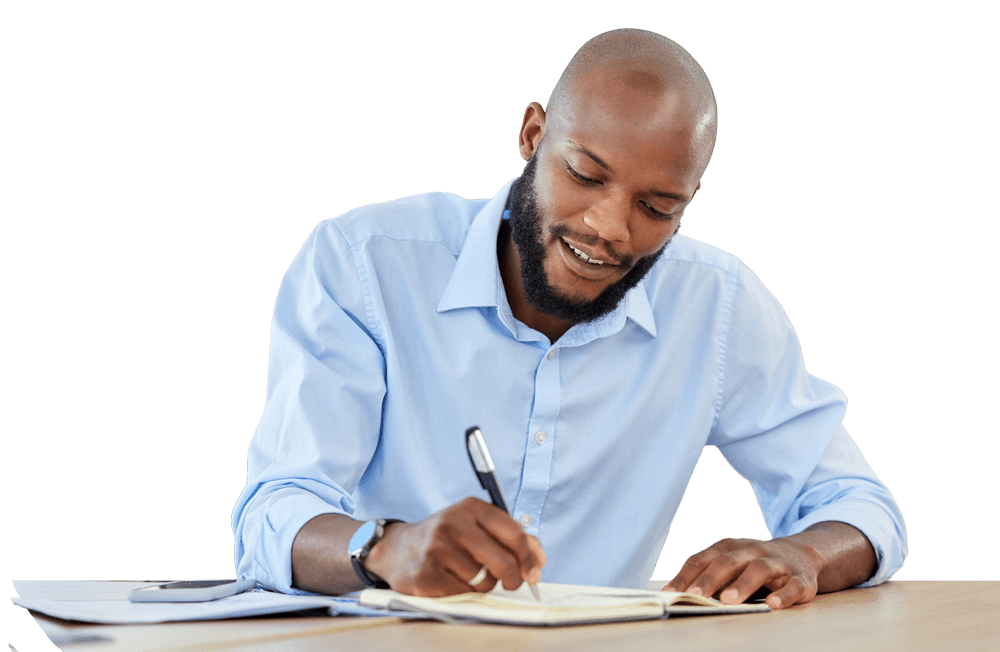 Man writing at a desk