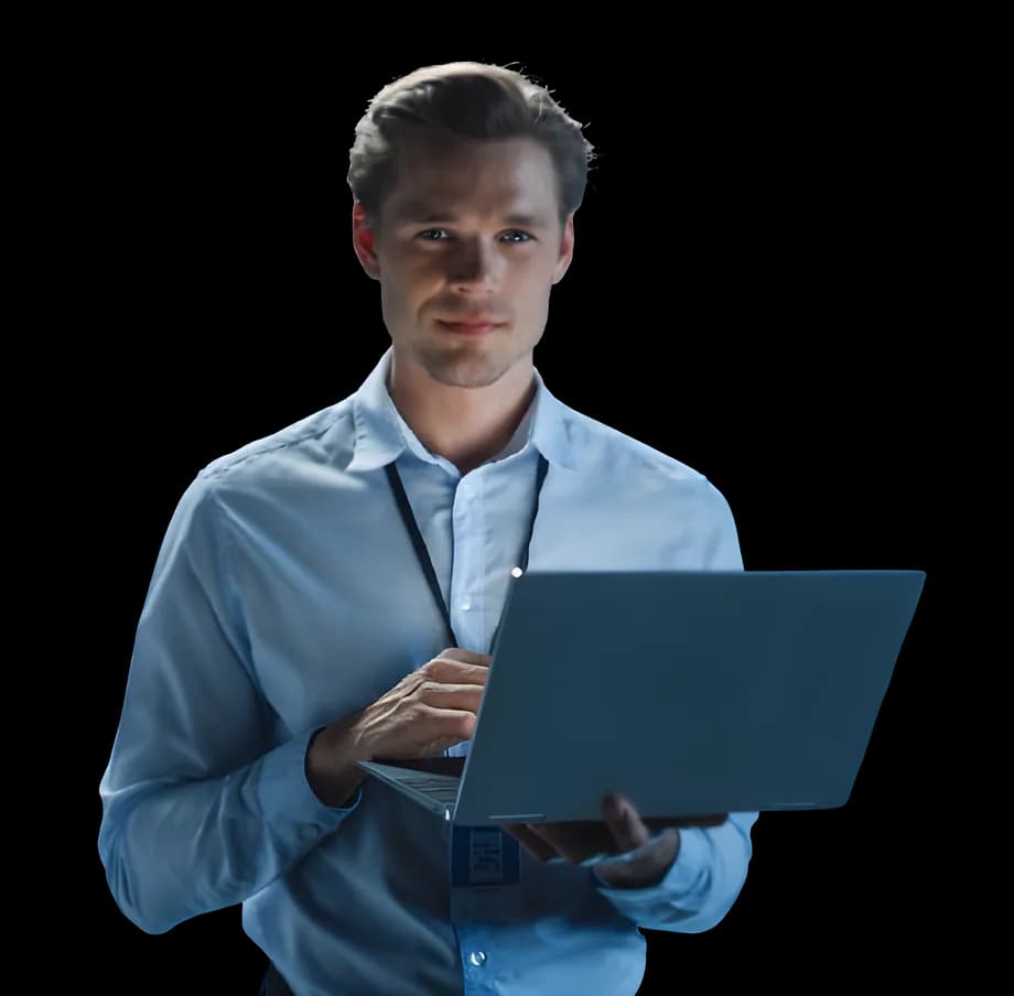 A man in a shirt holding a laptop