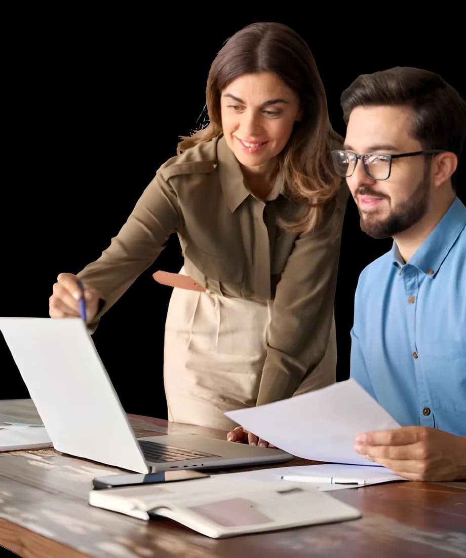 Two colleagues reviewing a marketing plan at a laptop